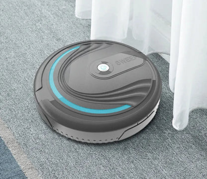 Black automatic sweeping robot vacuum cleaner with remote control on a wooden floor.