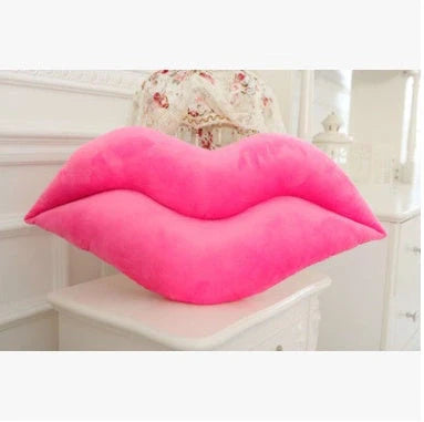 Adorable plush lip pillow for kids, available in pink and red, perfect for cuddling and play.