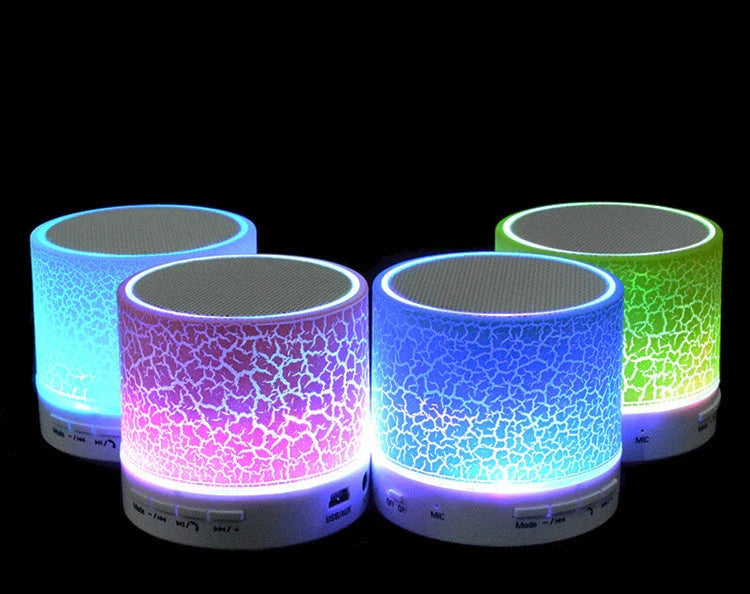 Compact wireless Bluetooth speakers in various colours, featuring premium audio components and sleek, durable design