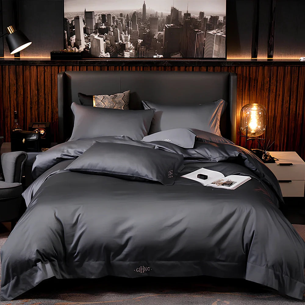 Four-piece cotton bedding set with satin weave fabric showing quilting detail and colour options