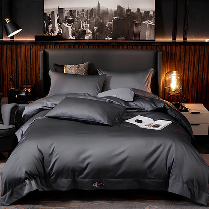 Four-piece cotton bedding set with satin weave fabric showing quilting detail and colour options