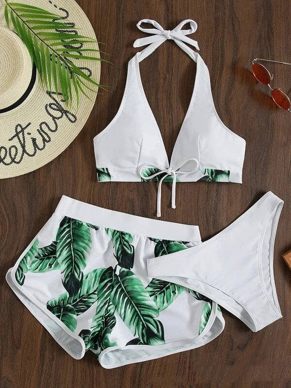 A stylish 3-piece leaf print bikini set with matching shorts, available in a variety of vibrant colors and patterns