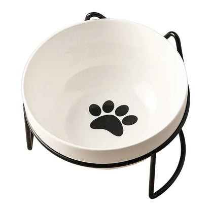White ceramic pet bowl with cat paw print in a black iron stand with cat ear details