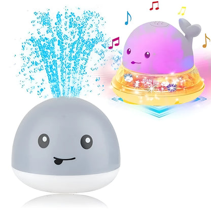 Grey or white electric whale bath toy spraying water with LED lights on a base.