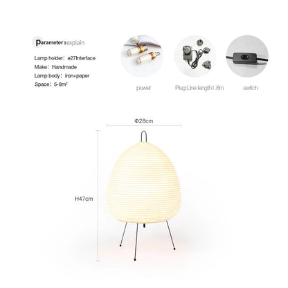 Japanese style table lamp with a white handmade rice paper shade on a slim aluminium base.