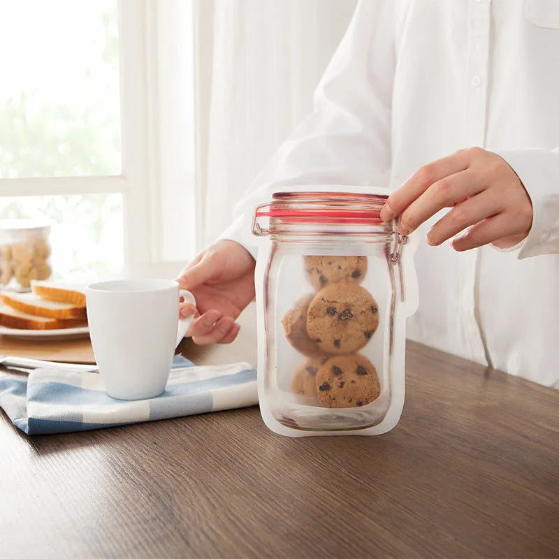 Red reusable self-sealing plastic bag for snacks with zipper closure, shown with biscuits.
