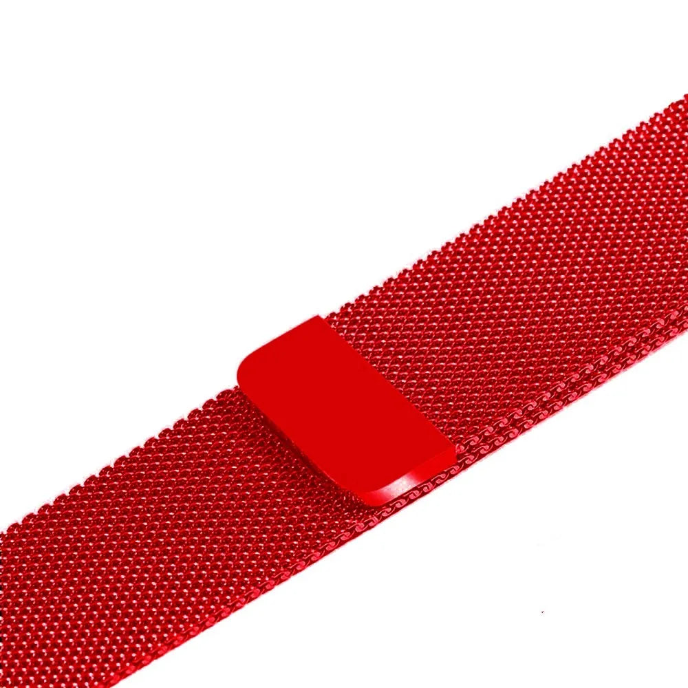 Stainless steel Apple Watch strap in silver on a wrist, showing the metal links and secure clasp.