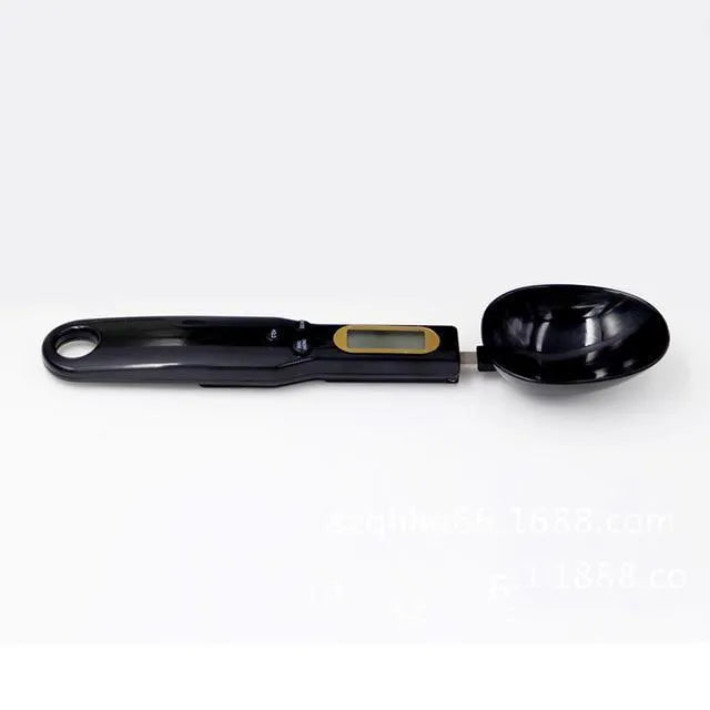 Black digital measuring spoon scale showing LCD display with weight reading