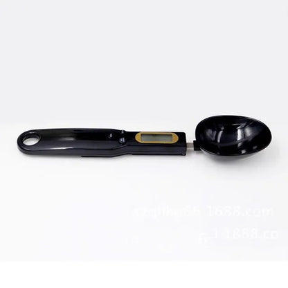 Black digital measuring spoon scale showing LCD display with weight reading
