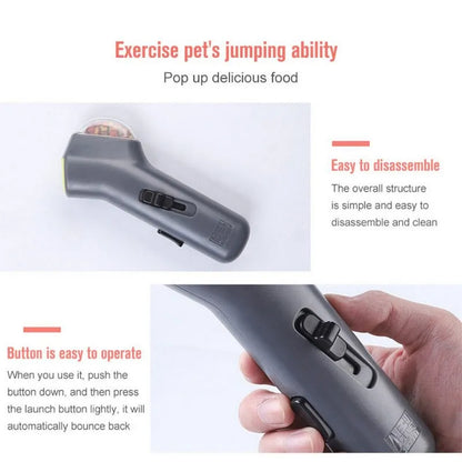 Grey-coloured pet treat catapult launcher for dogs and cats on a plain background.