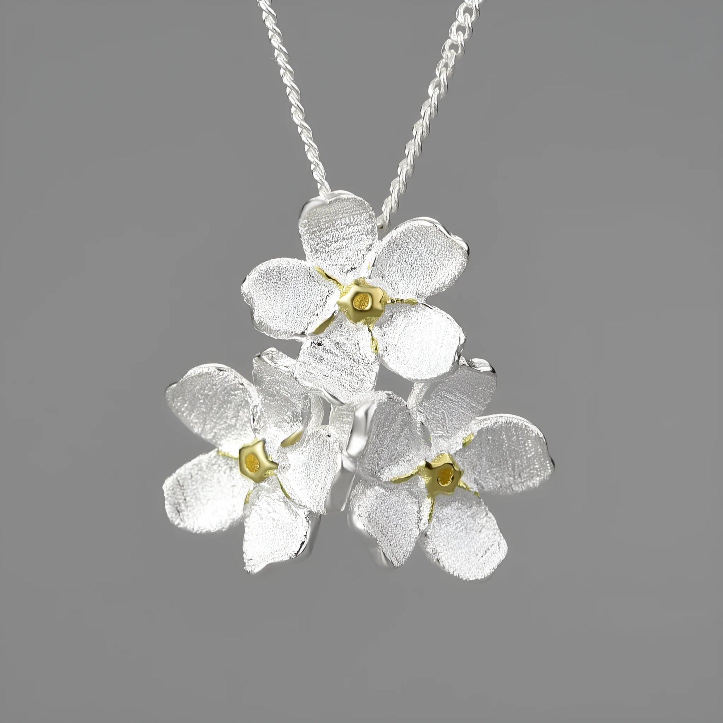Myosotis Sylvatica sterling silver floral pendant with open mouth design in pastoral style