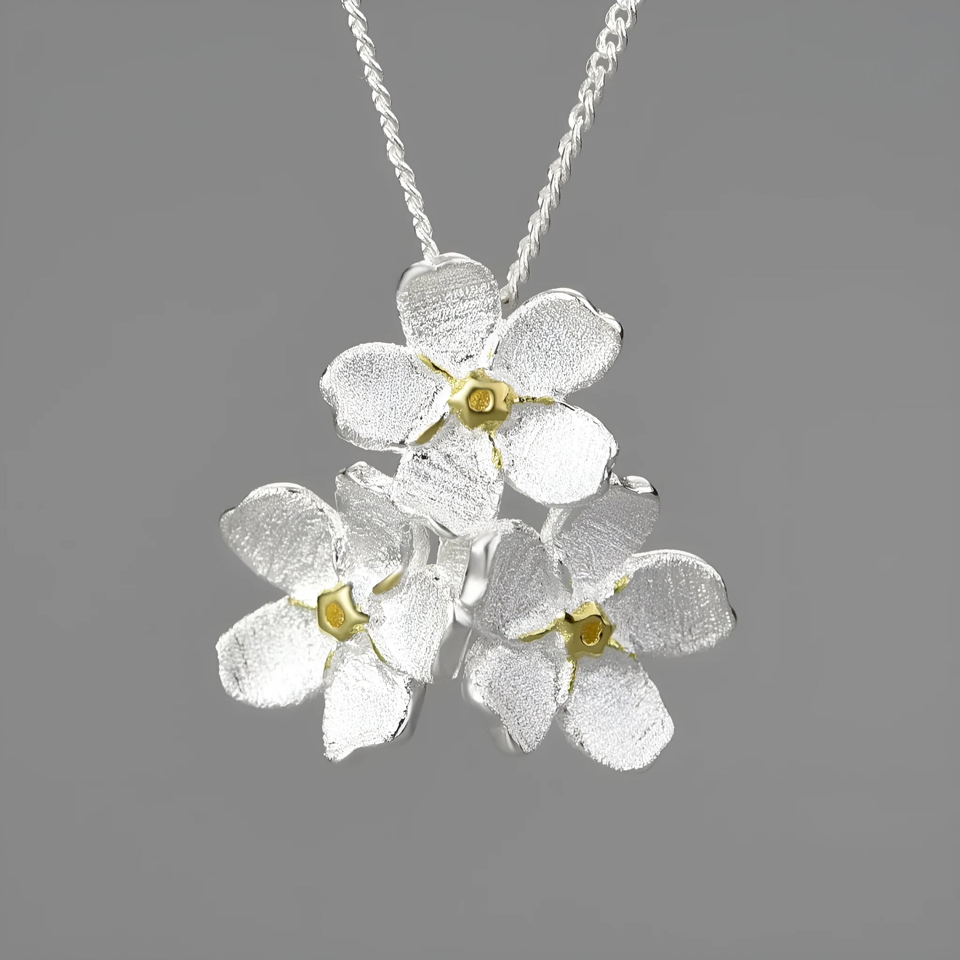 Myosotis Sylvatica sterling silver floral pendant with open mouth design in pastoral style