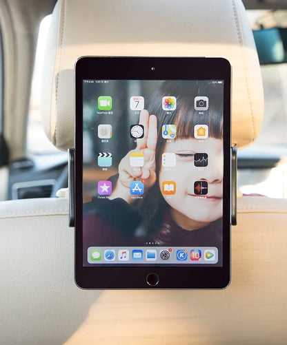 Black car phone holder mounted on vehicle rear seat with tablet secured in snap-in bracket