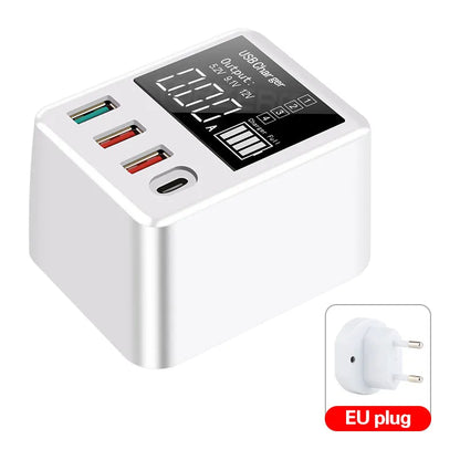 White 4-port USB travel wall charger with LED display and UK plug for fast charging phones and tablets.