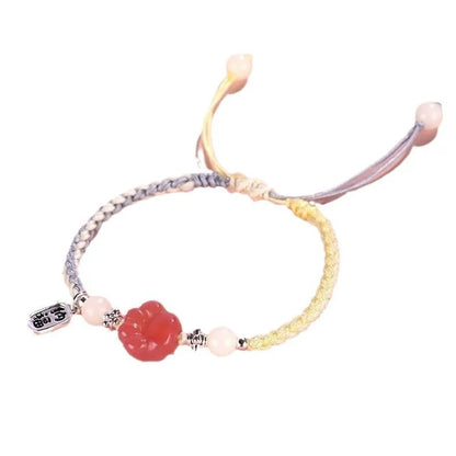 Handmade red cat's paw charm bracelet with glass beads in pink or yellow woven design
