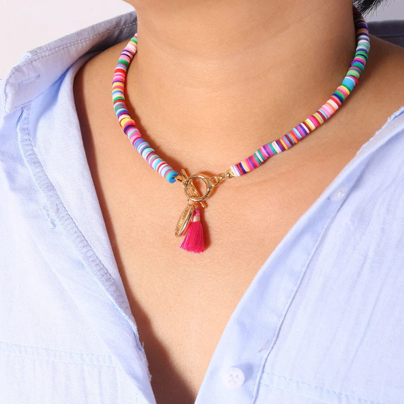 Bohemian shell tassel necklace for women featuring a unique shell charm and soft ceramic alloy tassel.