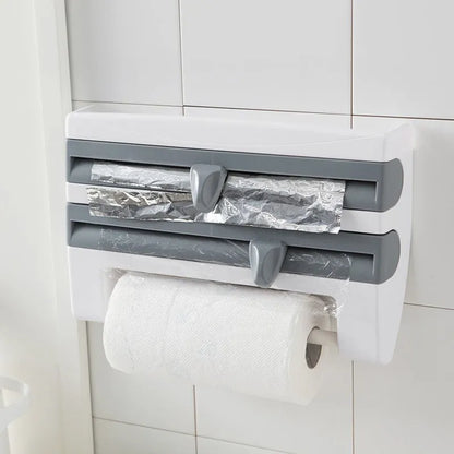 White wall-mounted kitchen roll holder dispenser for cling film, foil, and paper towels.