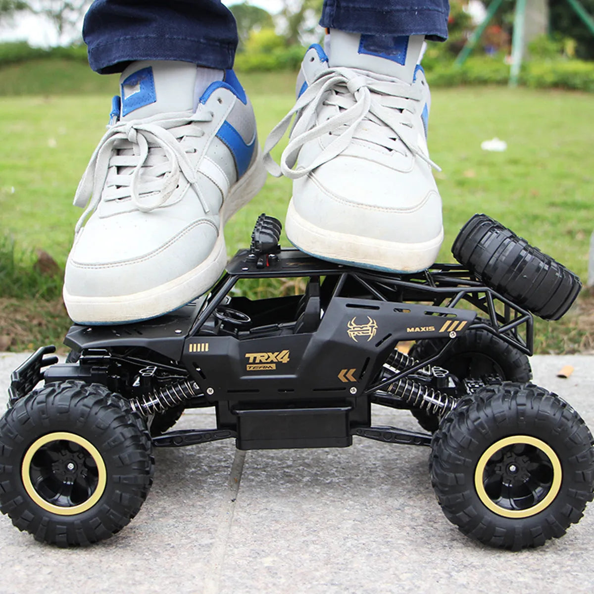 Four-wheel drive remote control car with 2.4G wireless controller on rough terrain