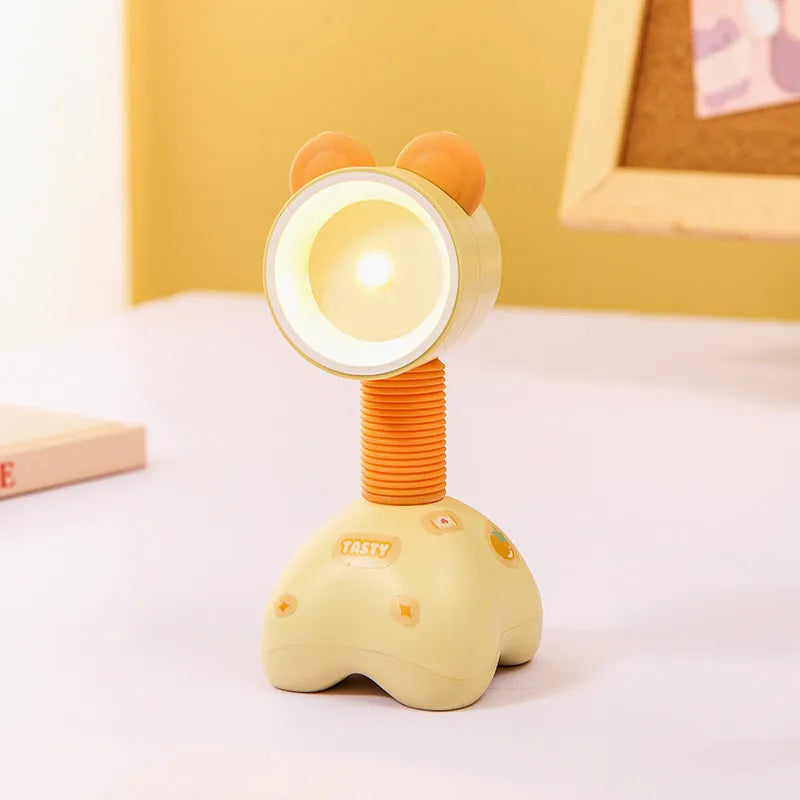 Colourful cartoon character magnetic DIY night light on a desk with adjustable head.