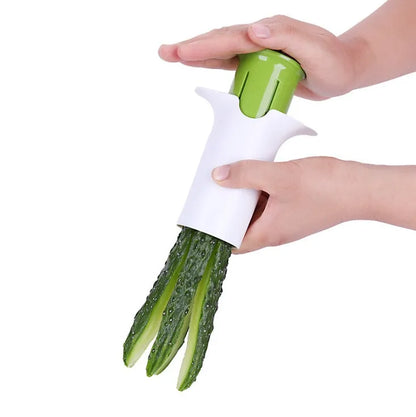 White ABS plastic kitchen slicer with six visible stainless steel blades for cutting cucumbers, carrots, and strawberries.
