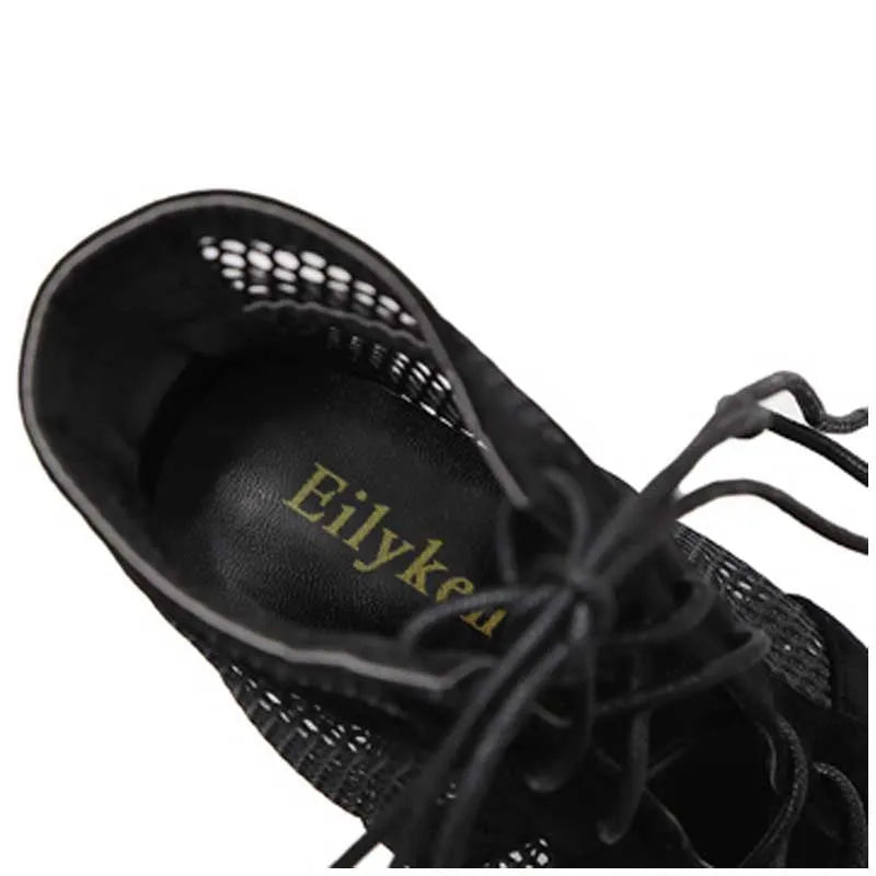 Black suede women's lace-up high-heel shoes with an 11.5 cm heel on a white background.