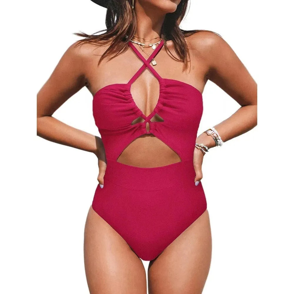 Women's black cross-back one-piece swimsuit with backless design on mannequin