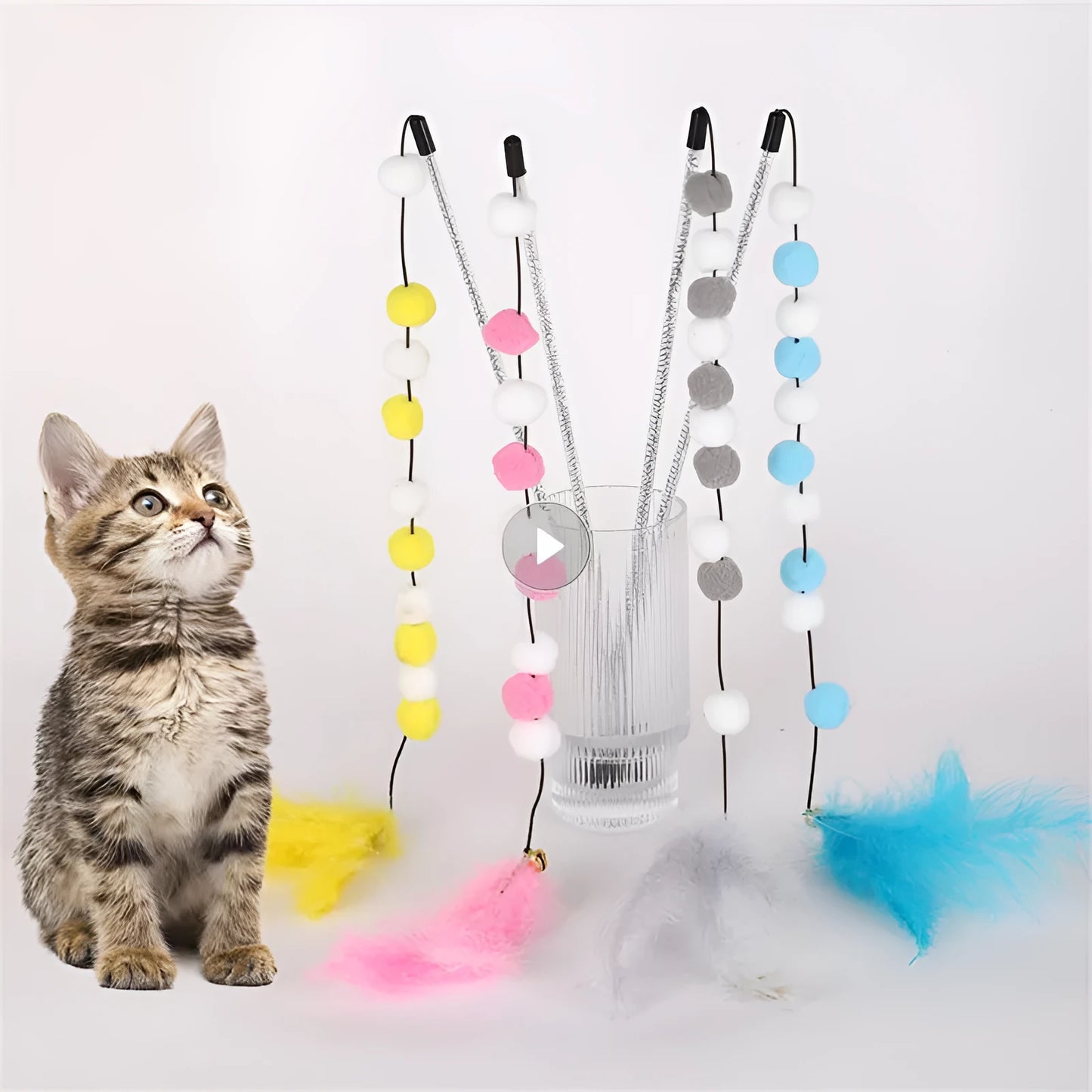Blue cat teaser stick toy with a bell and a grey feather pompon, shown next to a grey and yellow version.