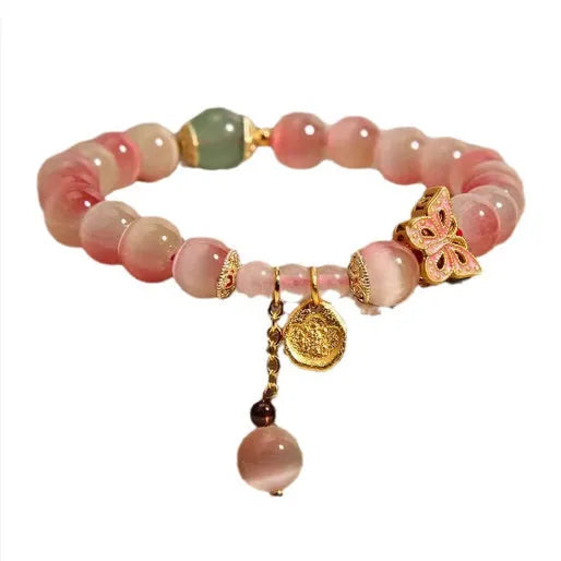 Women's bracelet crafted from genuine opal stone with intricate butterfly design in pink opal colour, electroplated finish for lasting colour, featuring Chinese style motifs for a unique jewellery accessory