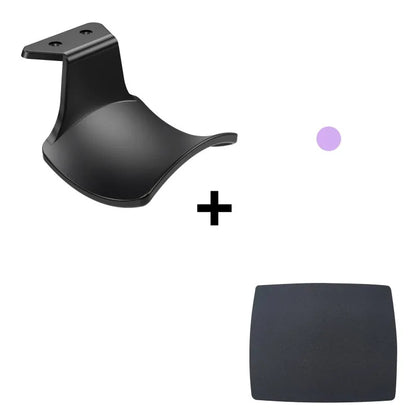 Black ABS plastic universal wall hanging rack for game controllers with adhesive pad and screws.