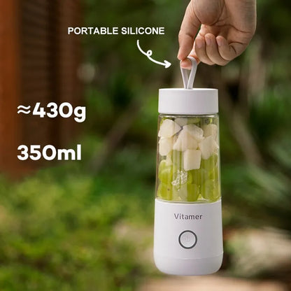White portable USB rechargeable blender bottle with silicone handle on a Tritan cup.