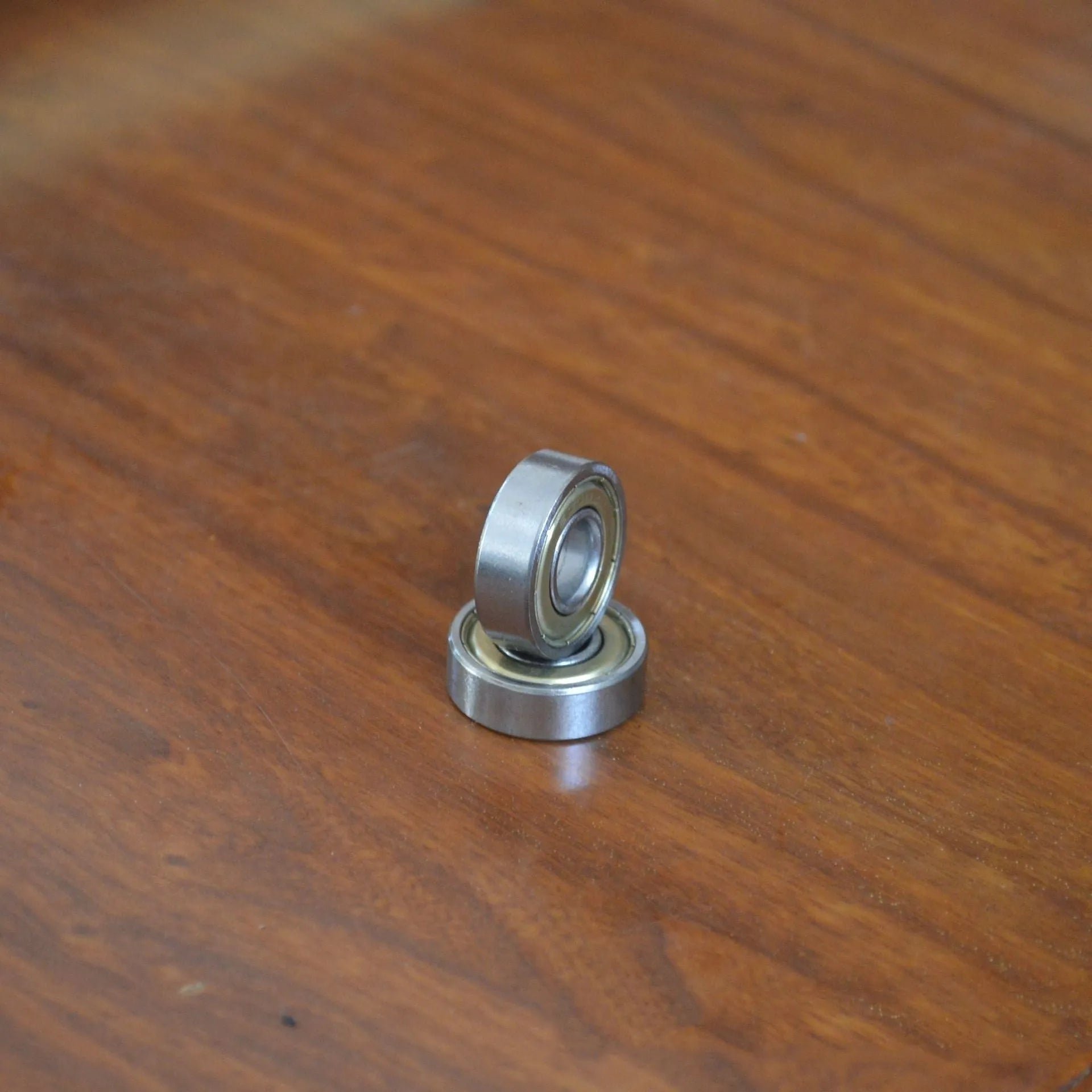 6000ZZ carbon steel ball bearing with 10x26x8mm dimensions and metal shields.