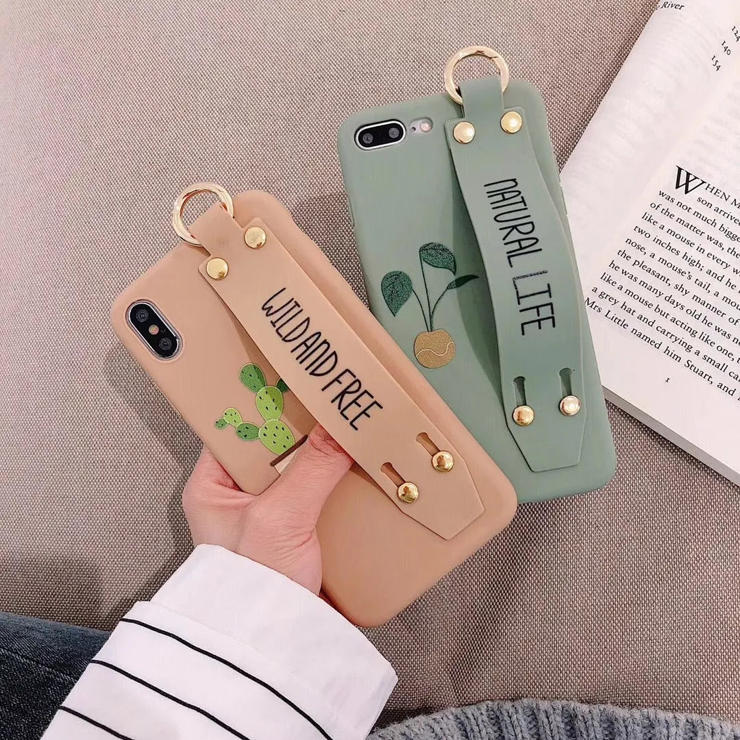 Green iPhone case with graffiti design and integrated wristband holder on back cover