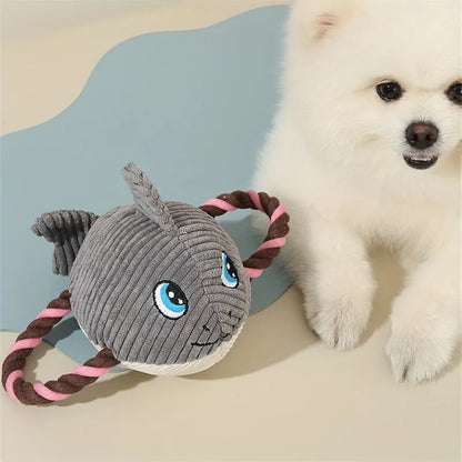 Grey turtle-shaped plush dog toy with a knotted rope chew core visible.