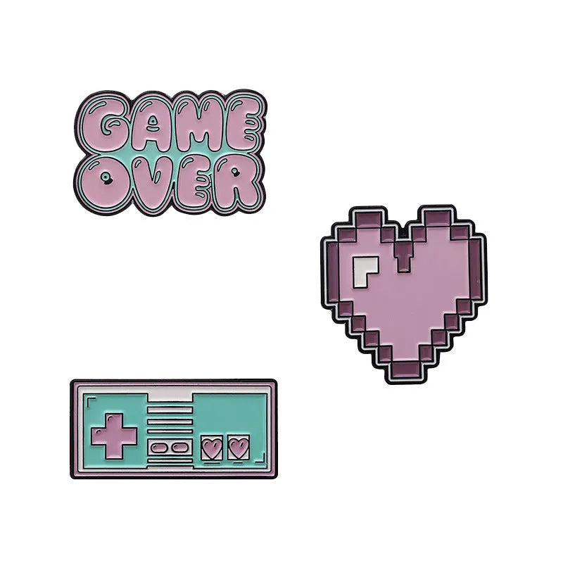 Stereo game console badge made of alloy metal for bag or jacket attachment.