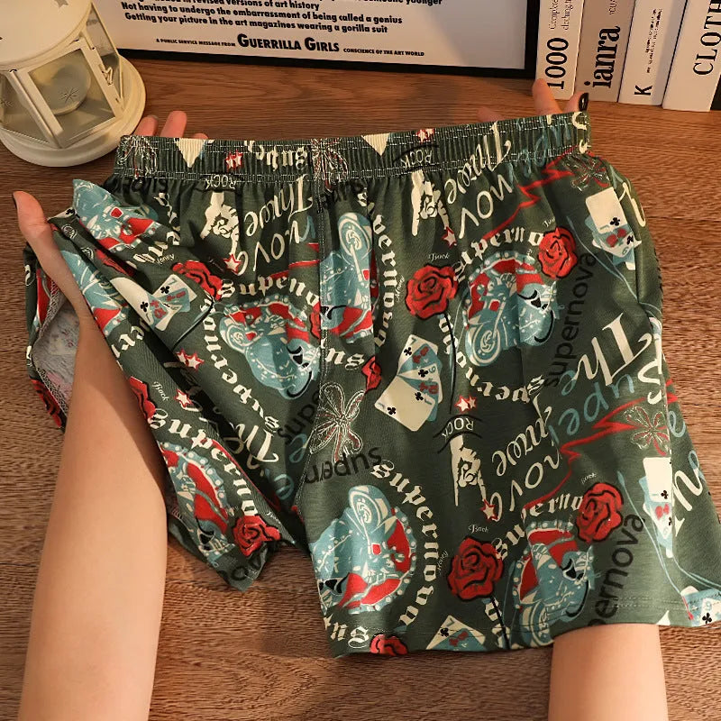 Men's loose fit cotton printed boxer shorts in a grey and blue pattern on a mid waist design.