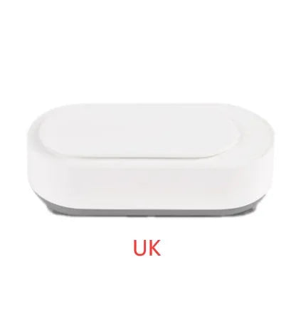 White portable ultrasonic cleaner with stainless steel tank for cleaning jewellery and glasses.