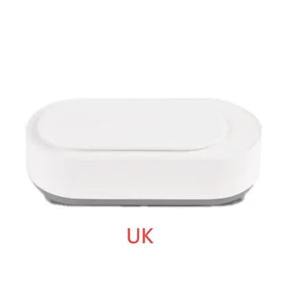 White portable ultrasonic cleaner with stainless steel tank for cleaning jewellery and glasses.