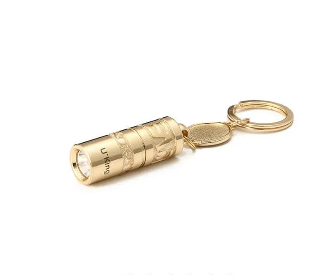 Gold zinc alloy keychain torch with LED light, shown attached to a keyring.