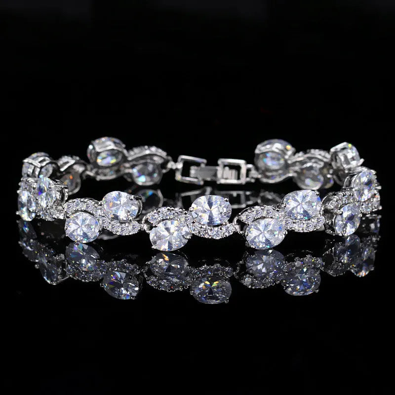 Copper-plated gold bracelet with AAA+ zircon stones in simple geometry style measuring 18.4cm length
