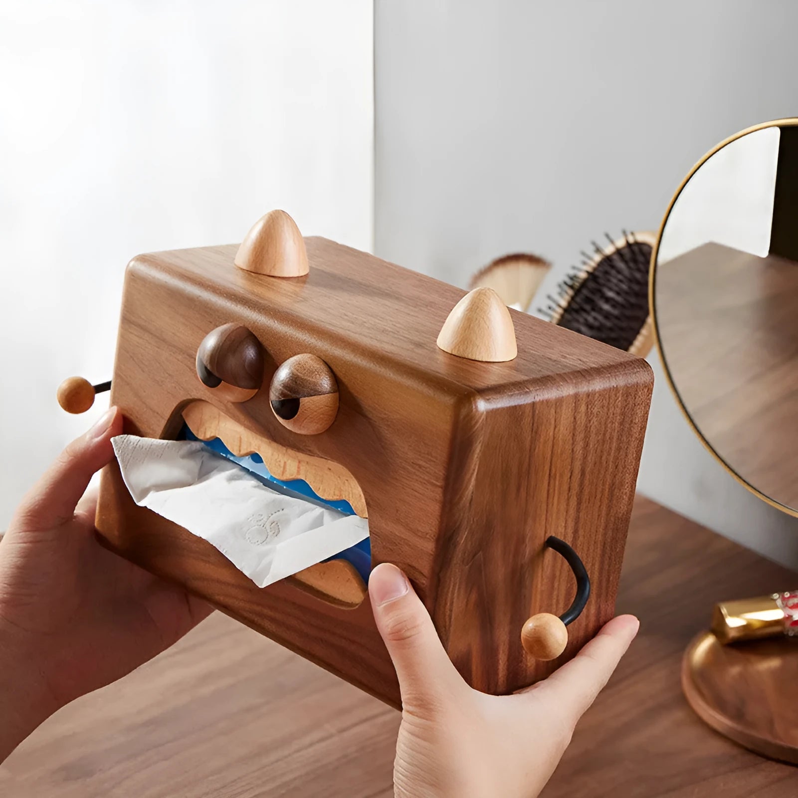 Wooden tissue box with cartoon monster design in walnut and beech colours