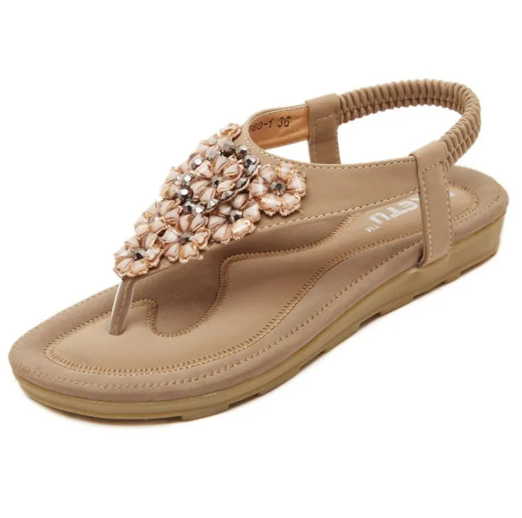 Women's flat sandals with floral rhinestone detail, open side, elastic ankle strap, apricot colour