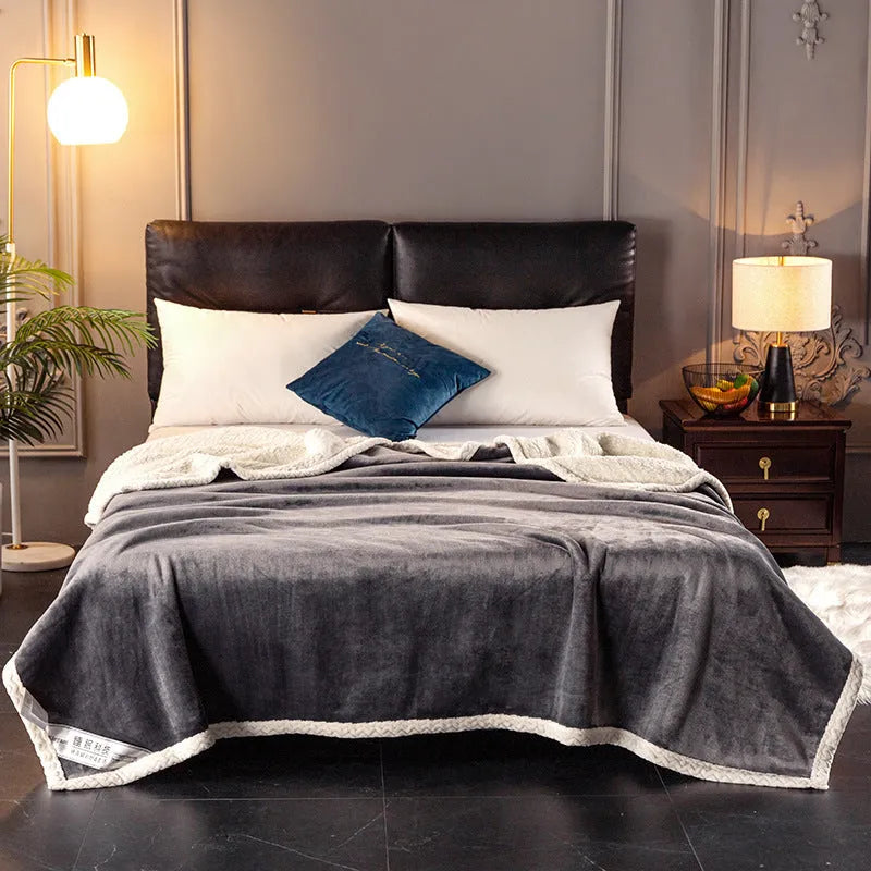 A thick, plain coral fleece blanket in a choice of colours, folded to show its texture.