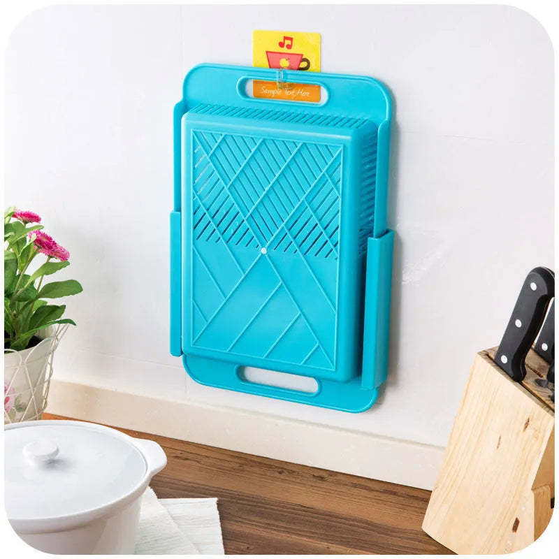 Blue multifunction kitchen chopping board with integrated sink drain basket and TPE handle.