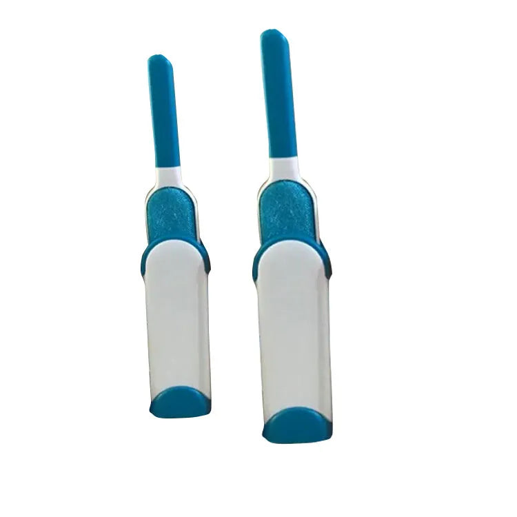 Blue reusable pet hair removal brush with double-sided head next to its self-cleaning base.
