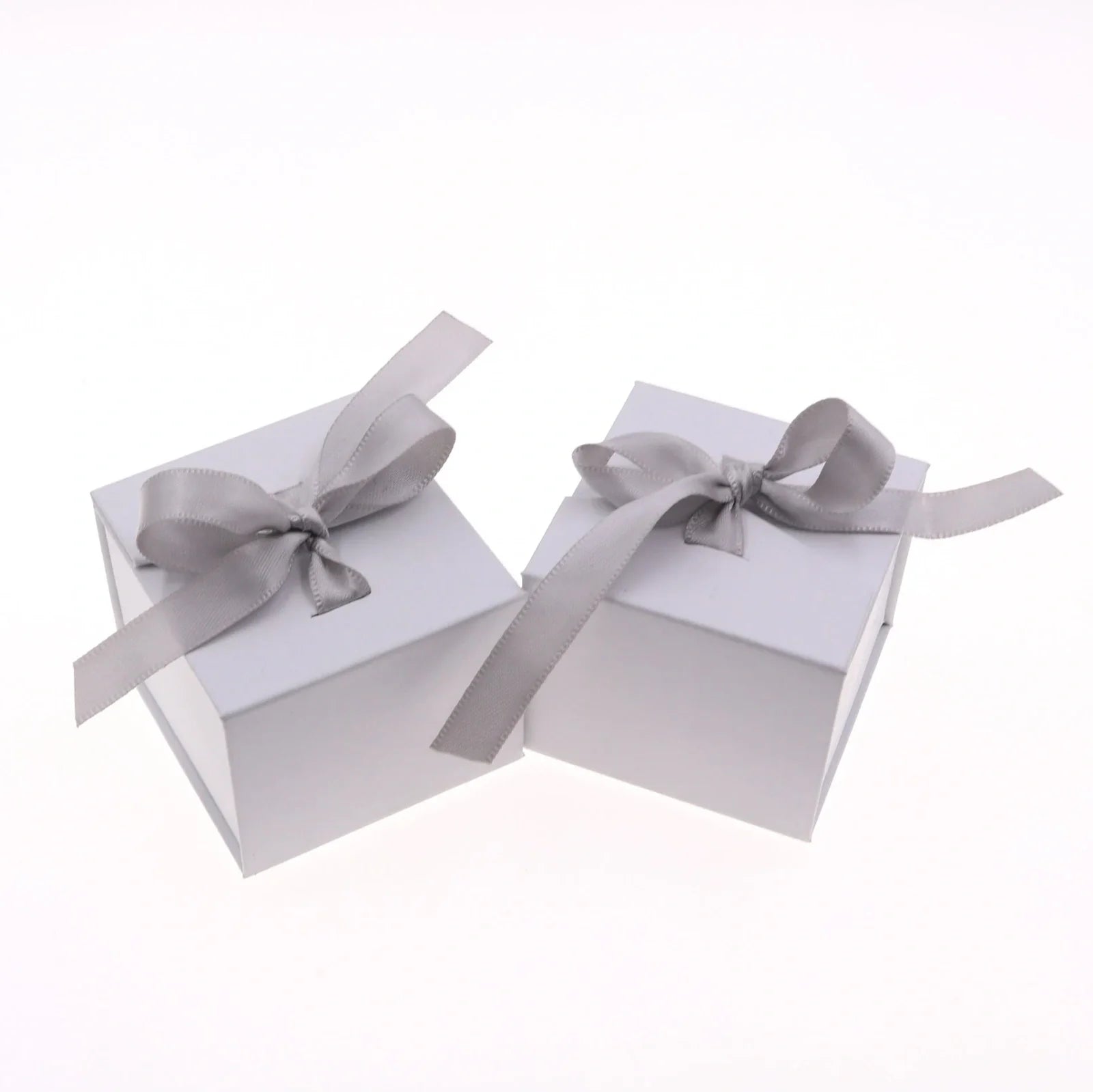Grey square jewellery box with white ribbon bow measuring 5x5x4cm with sponge-lined interior