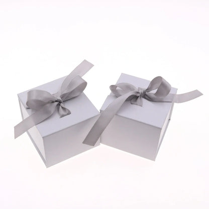 Grey square jewellery box with white ribbon bow measuring 5x5x4cm with sponge-lined interior