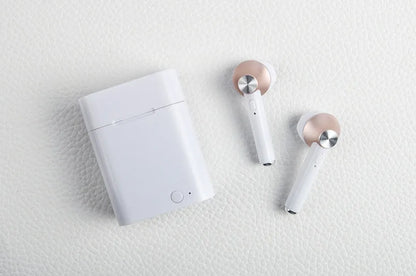 Black wireless sports Bluetooth earbuds showing battery display and placed next to a smartphone.