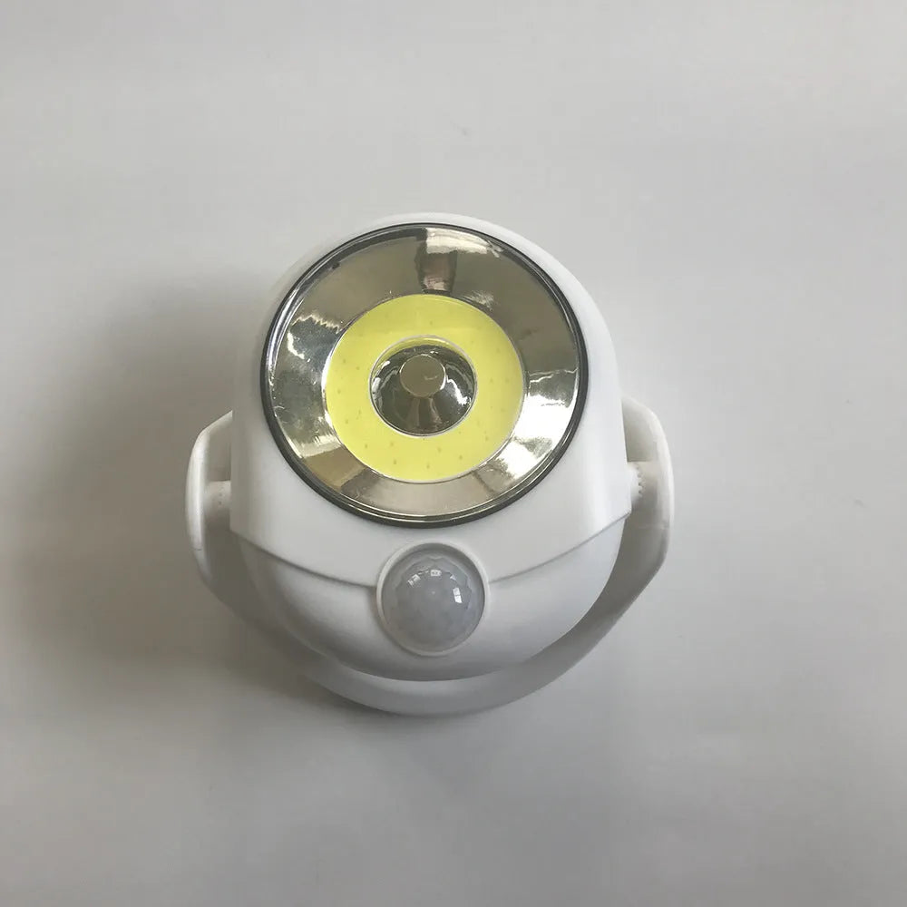 White angel design induction night light on table showing dimensions