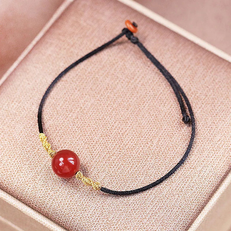 Hand-woven red agate bracelet and necklace set for women in national style with bead design.