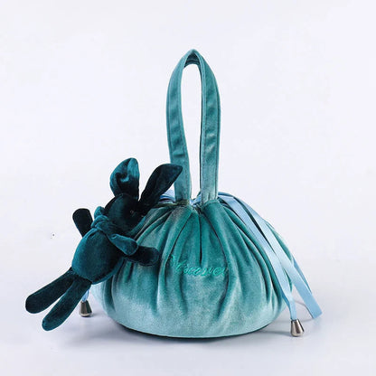 Adorable rabbit ear velvet cosmetic bags in various colors for storing and organizing makeup, toiletries, and other beauty essentials.